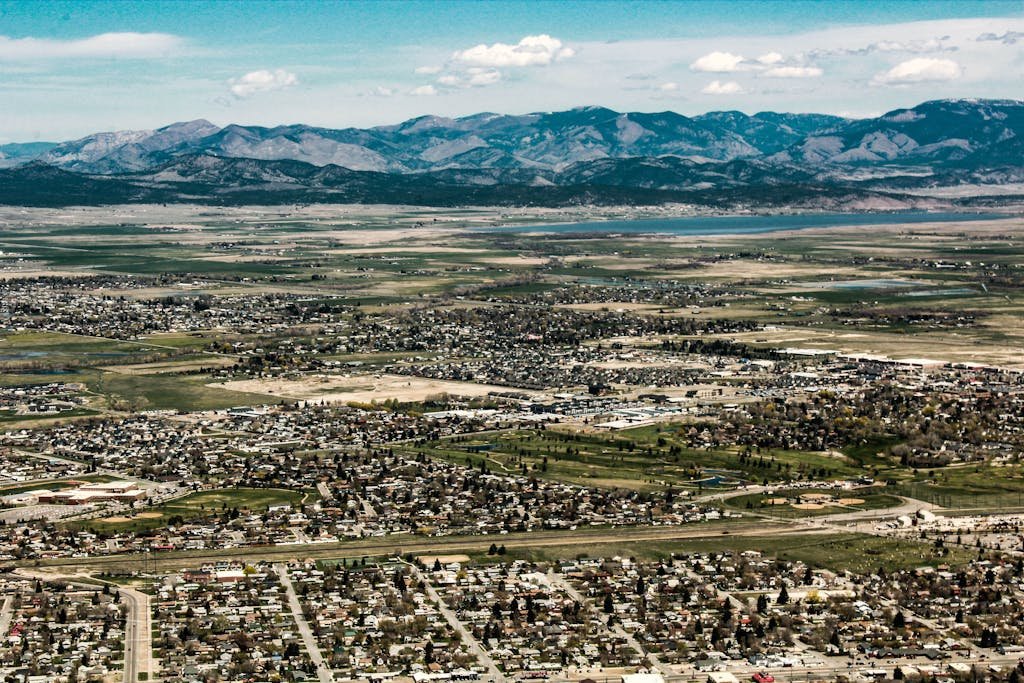 Explore the scenic landscape of Helena, Montana with vast fields and mountain views.